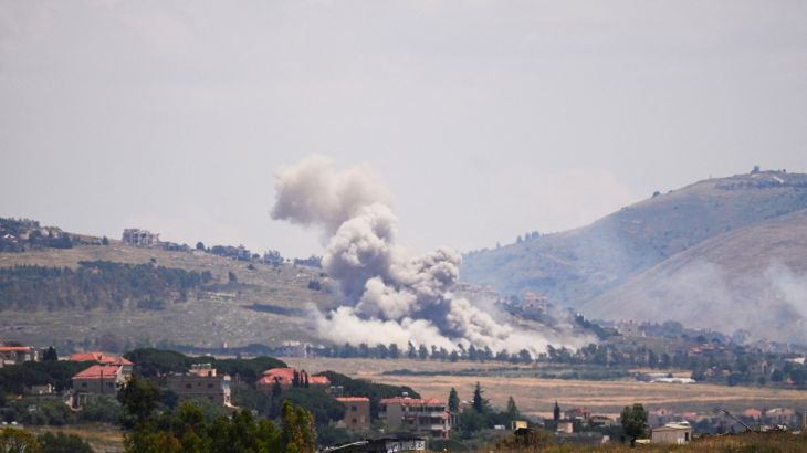 Israeli military intercepts Hezbollah aerial assault, causing damage in Kiryat Shmona.